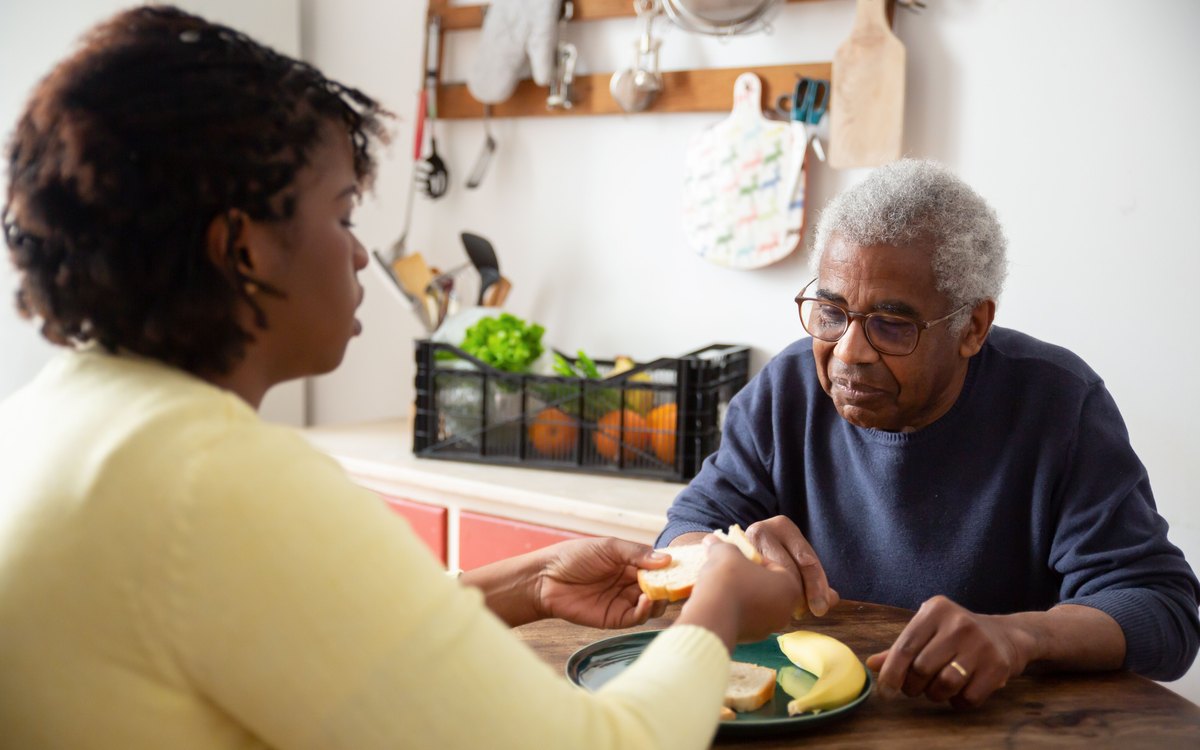Sharing a meal together at the kitchen table during daily living support